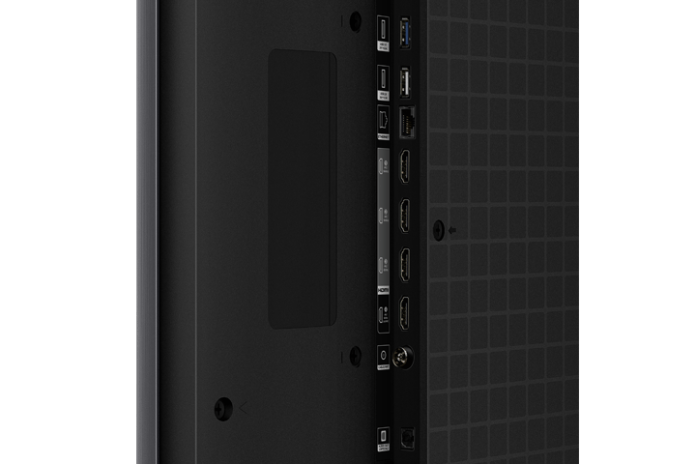 Close-up view of the back panel of a TCL 85-inch TV, showcasing various connectivity ports including HDMI and USB, along with a sleek, modern design.