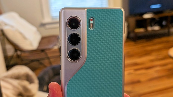 Close-up of the TECNO Camon 40 Pro 5G smartphone showcasing its unique camera design and textured back in Emerald Lake Green.