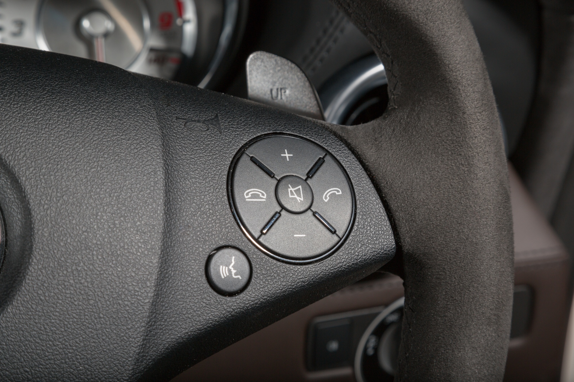 Closeup shot of call buttons on the steering wheel of a modern car