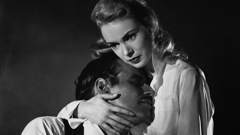 Charlton Heston and Janet Leigh embracing as newlyweds Miguel and Susan Vargas in Touch of Evil