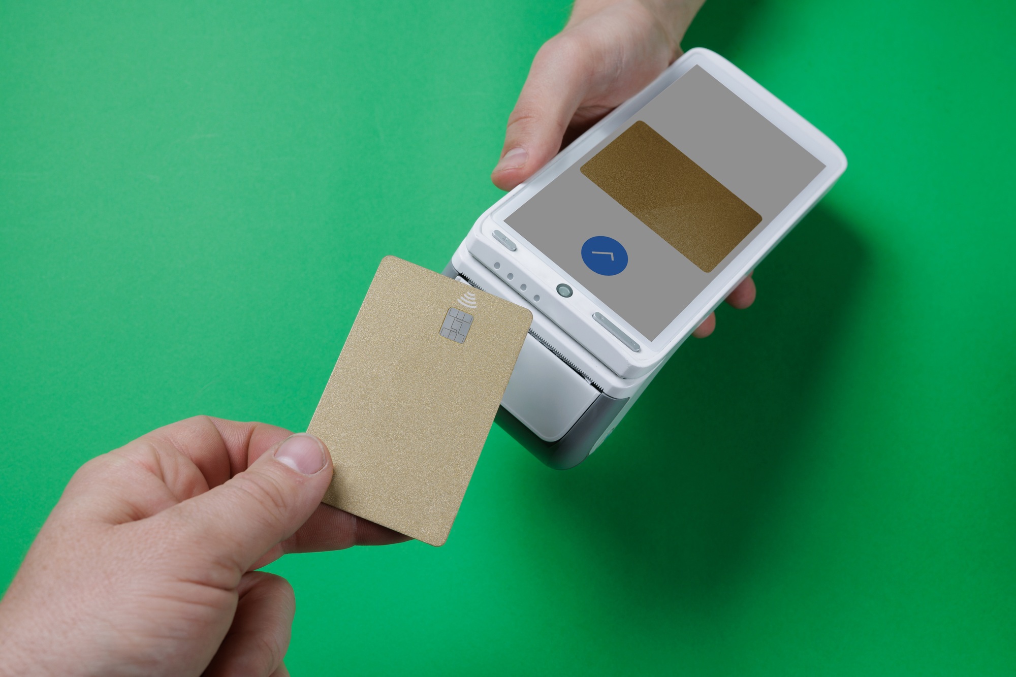 Gold card contactless transaction on POS terminal with green background.