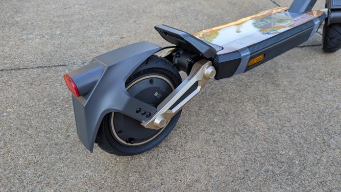 Close-up of the rear wheel and brake assembly of the Navee ST3 Pro scooter, showcasing its sleek design and dual suspension system.