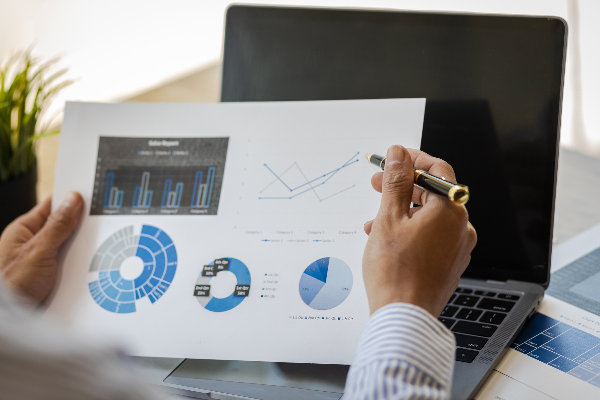 Business people working with financial documents analyzing business financial data.