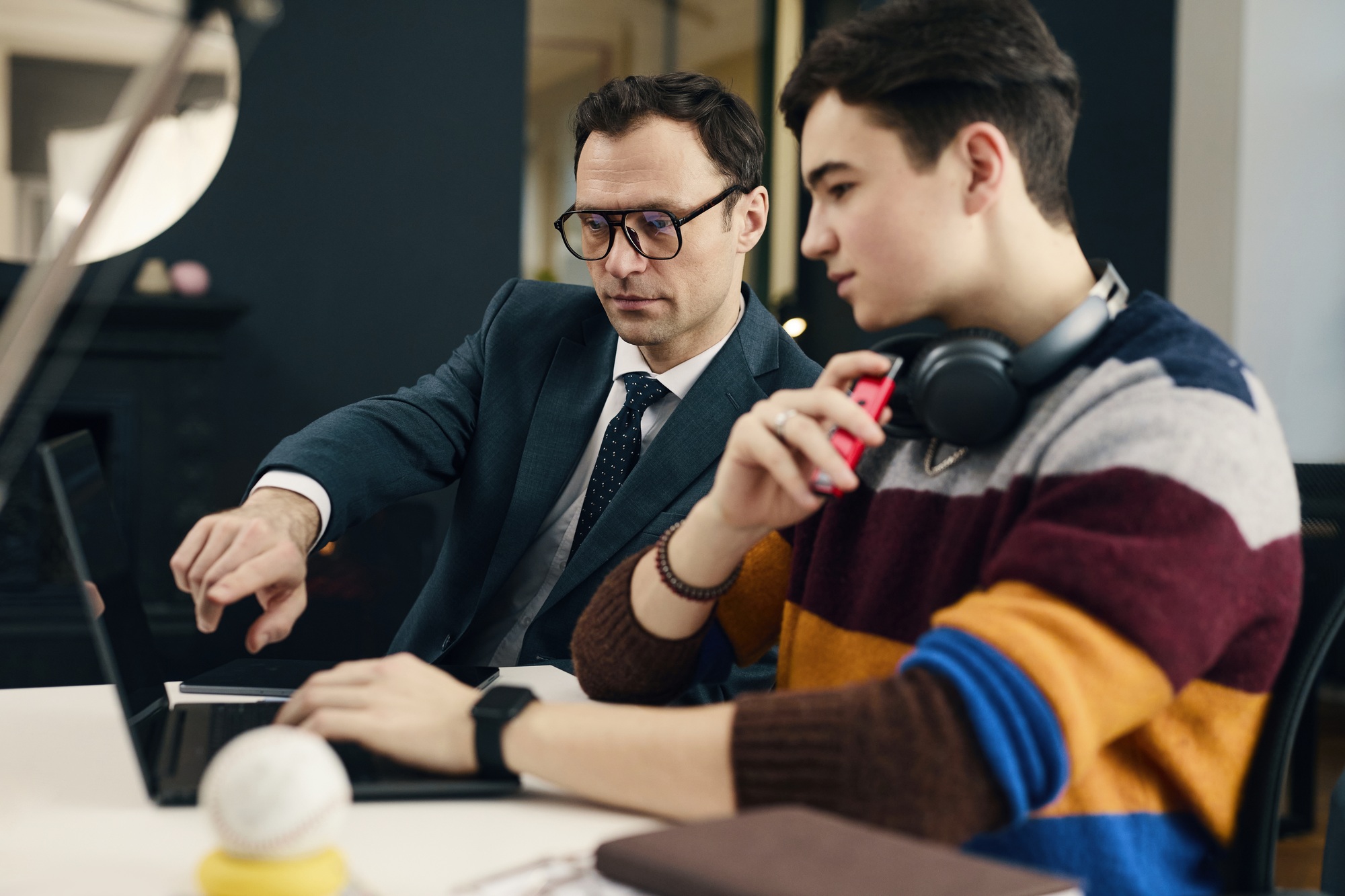 Businessman Mentoring New Employee In Office
