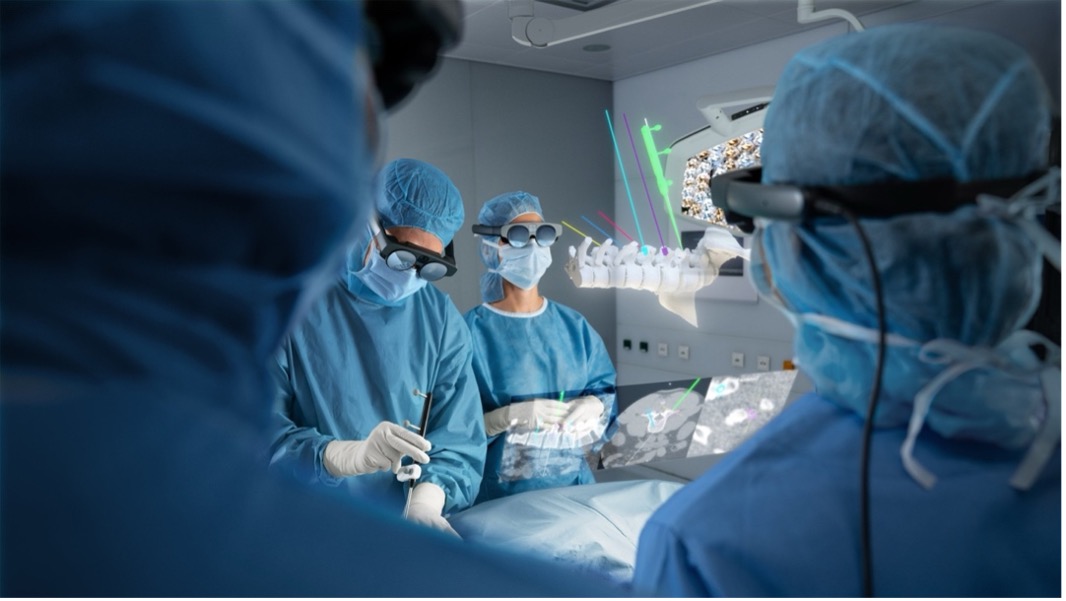 an artist’s rendering of an operating room, featuring surgeons wearing augmented reality glasses and looking at a virtual spine, hovering in mid-air above the patient.