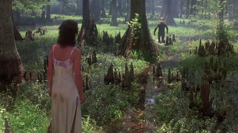 Adrienne Barbeau as Alice watching Swamp Thing walk in the swamp in Swamp Thing (1982)