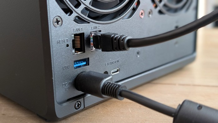 Close-up view of the rear panel of Synology DS925+ NAS, featuring dual LAN ports, USB port, expansion port, and power connection.