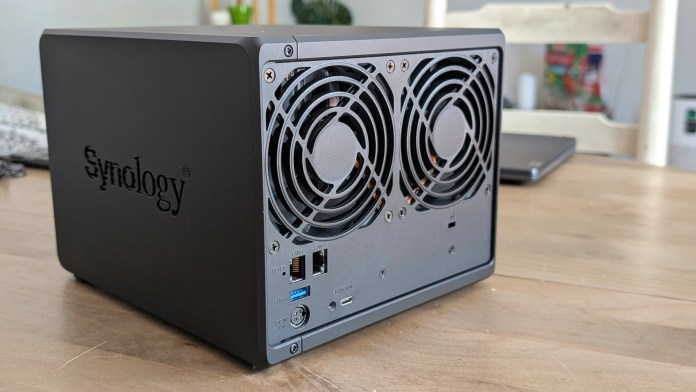 Close-up view of the back of a Synology DiskStation DS925+ NAS, featuring dual cooling fans, various ports including LAN and USB, and a matte black finish.