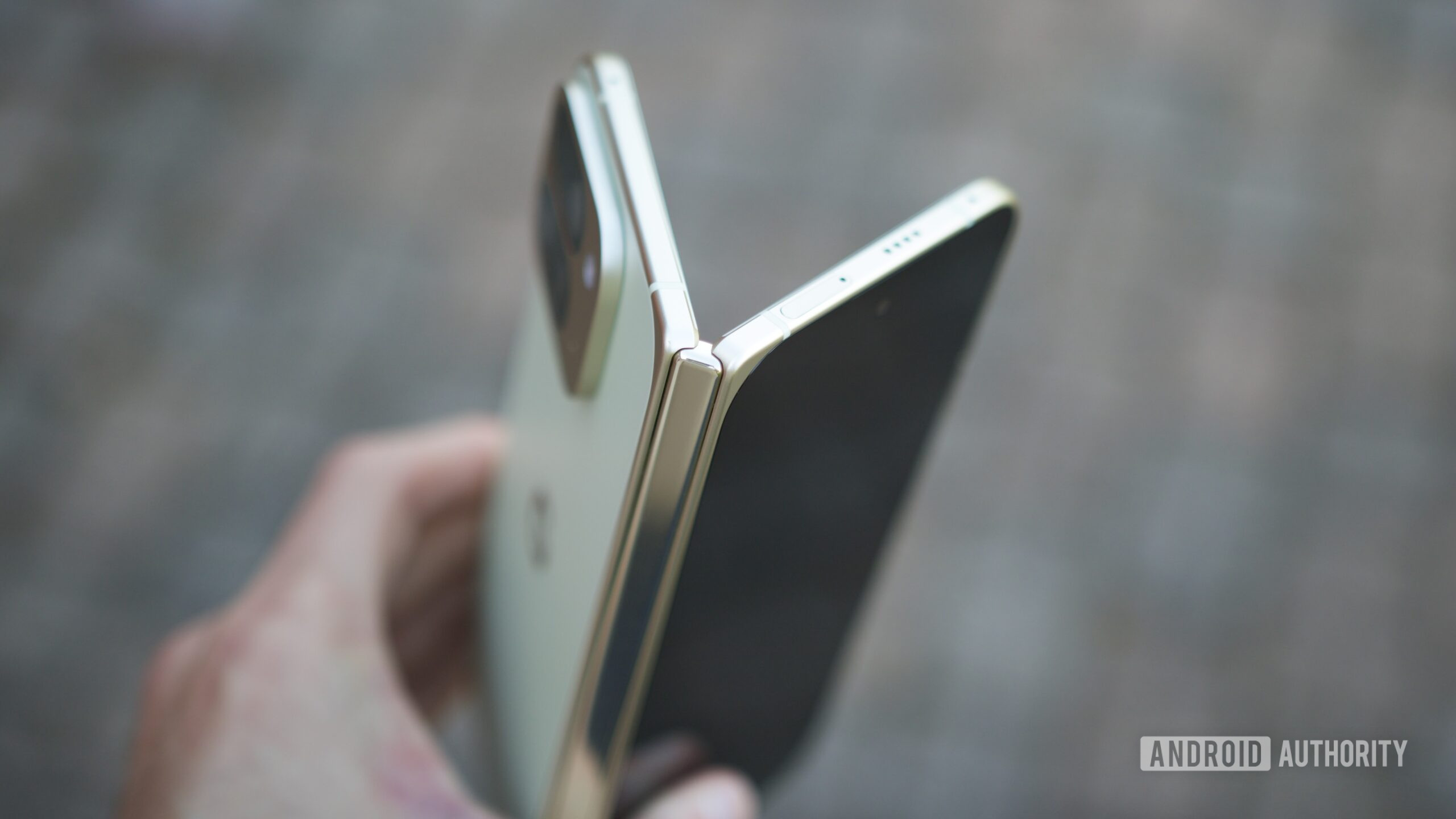 google pixel 10 pro fold holding half open The Google Pixel 10 Pro Fold half-opened, showing its hinge.