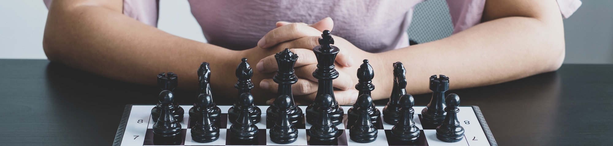 The chess board shows leadership, Hand of businesswoman moving chess in competition shows leadership